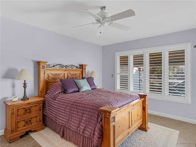 tiled bedroom featuring ceiling fan