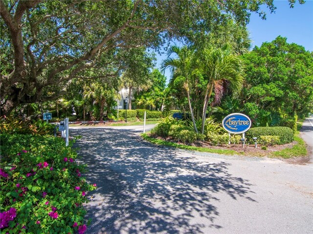 8444 Oceanside Dr Unit D31, Indian River Shores, FL 32963 - view of road featuring view of wooded area