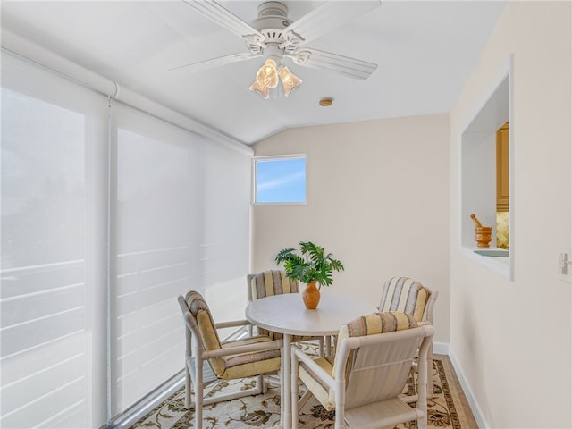 dining room featuring lofted ceiling and ceiling fan