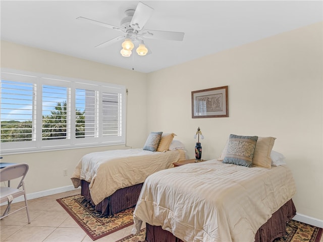 bedroom featuring light tile patterned floors and ceiling fan