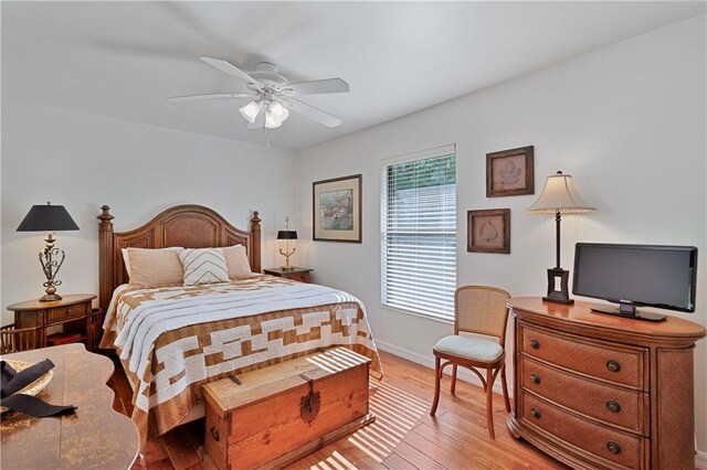 bedroom with light wood-type flooring and ceiling fan