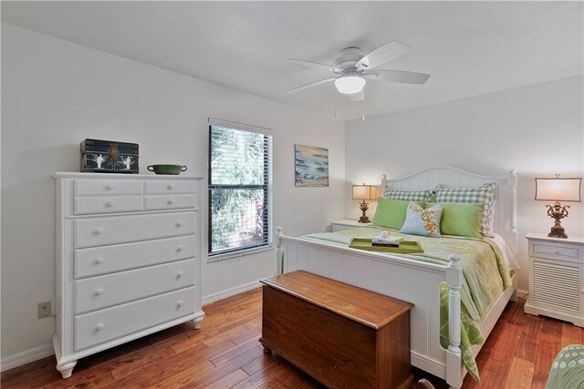 bedroom with hardwood / wood-style floors and ceiling fan