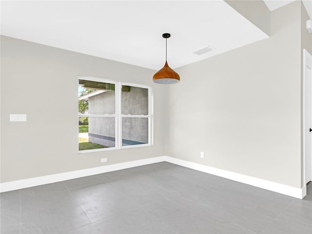 spare room with tile patterned floors