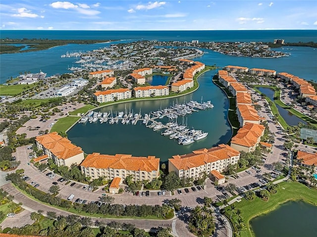 birds eye view of property with a water view