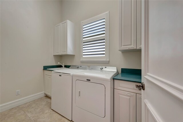 laundry room featuring sink, cabinets, independent washer and dryer, and light tile patterned floors