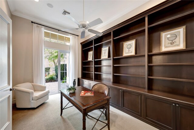 living area featuring ceiling fan, light carpet, and ornamental molding