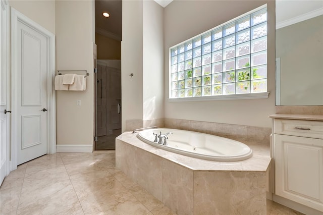 bathroom featuring ornamental molding, vanity, and plus walk in shower