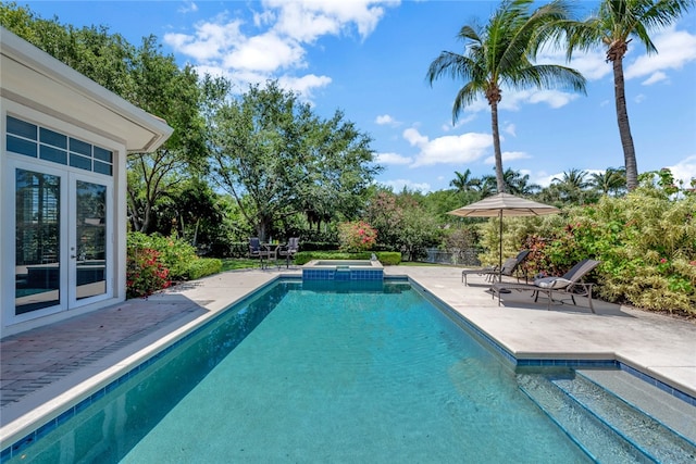 view of swimming pool featuring a patio area