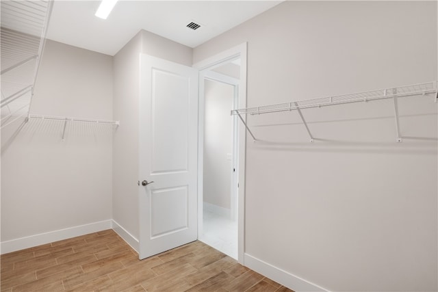 spacious closet featuring wood-type flooring