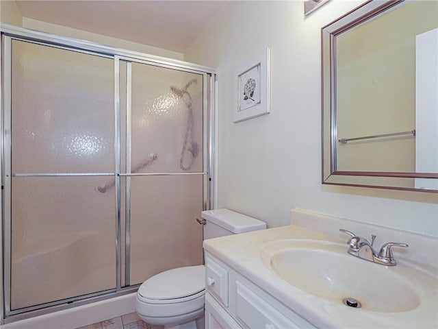 14 Vista Gardens Trl Unit 102, Vero Beach, FL 32962 - bathroom featuring a stall shower, toilet, and vanity