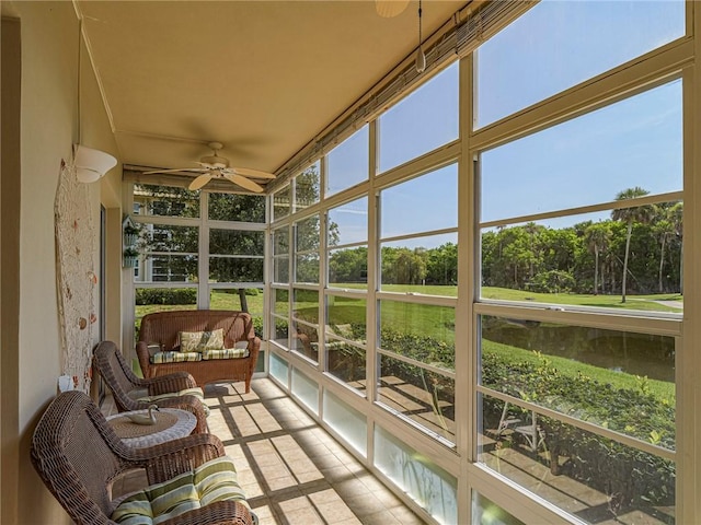 14 Vista Gardens Trl Unit 102, Vero Beach, FL 32962 - sunroom featuring ceiling fan, plenty of natural light, view of scattered trees, and outdoor lounge area
