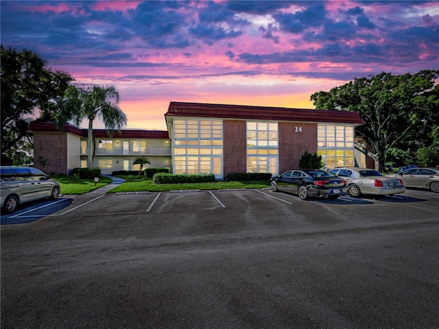 view of outdoor building at dusk