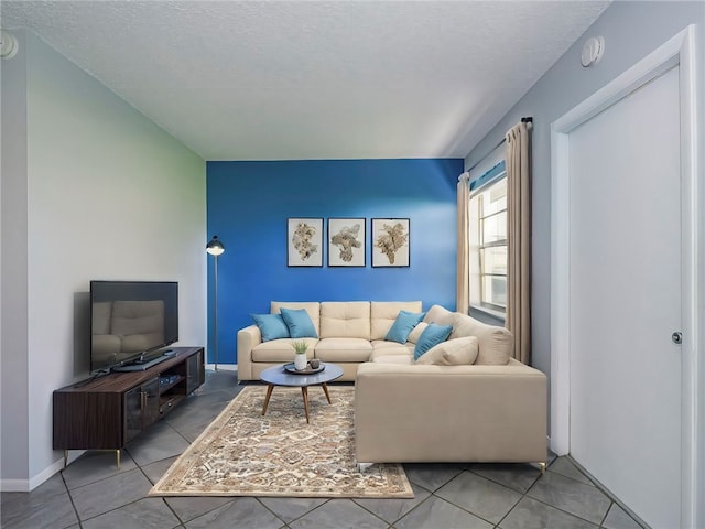 tiled living room with a textured ceiling