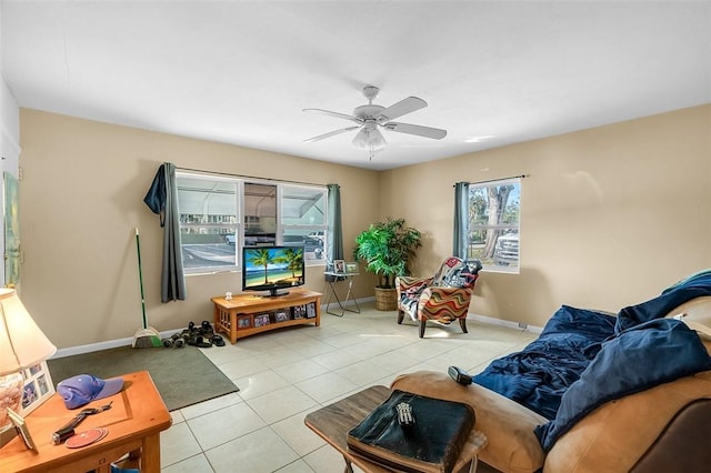 tiled living room featuring ceiling fan