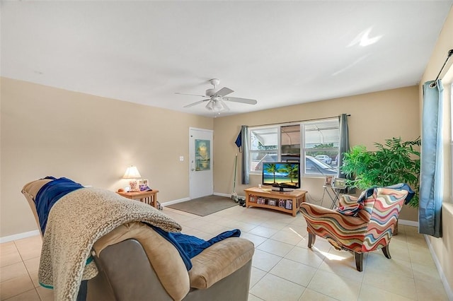 living room featuring ceiling fan and light tile patterned floors