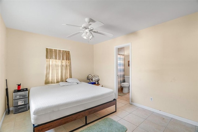 bedroom featuring light tile patterned floors, ensuite bath, and ceiling fan