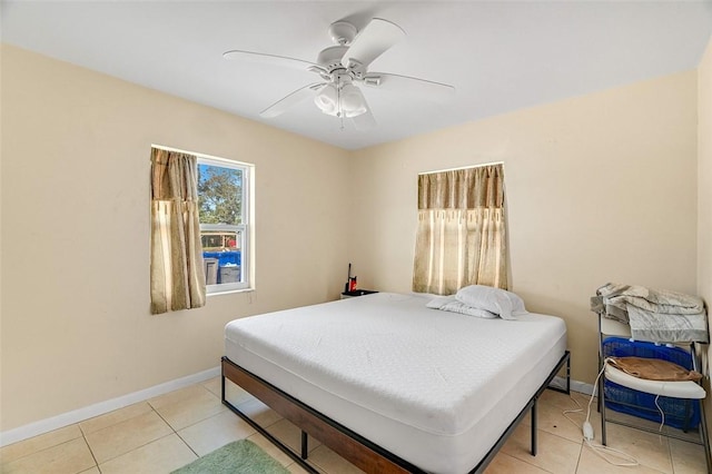 bedroom with light tile patterned flooring and ceiling fan