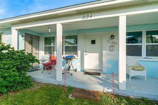 doorway to property featuring covered porch