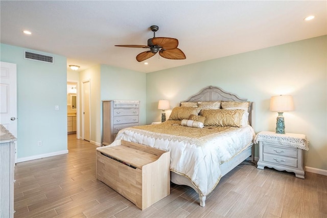 bedroom featuring recessed lighting, wood finished floors, visible vents, and baseboards