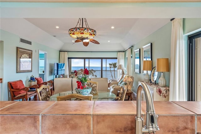 dining space with vaulted ceiling, visible vents, and recessed lighting