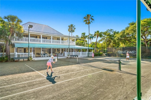 view of tennis court with fence