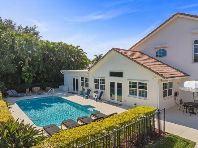 1880 Cobia Dr, Vero Beach, FL 32960 - view of pool featuring french doors, a patio area, and fence