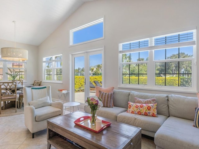 1880 Cobia Dr, Vero Beach, FL 32960 - living area featuring high vaulted ceiling and light tile patterned flooring