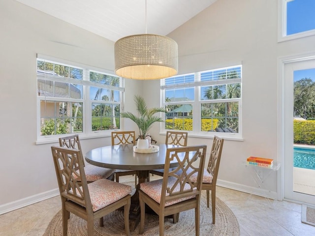 1880 Cobia Dr, Vero Beach, FL 32960 - dining area with high vaulted ceiling and baseboards