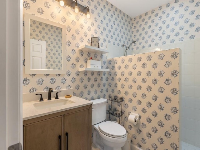 1880 Cobia Dr, Vero Beach, FL 32960 - bathroom with wallpapered walls, toilet, vanity, and a tile shower