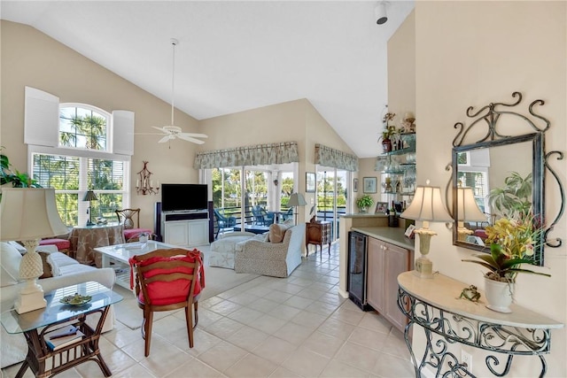 living room with high vaulted ceiling, wine cooler, ceiling fan, and light tile patterned flooring