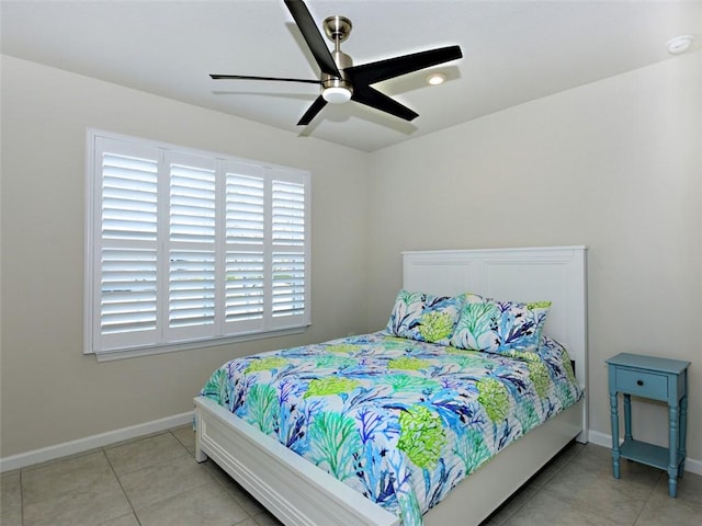 tiled bedroom featuring ceiling fan