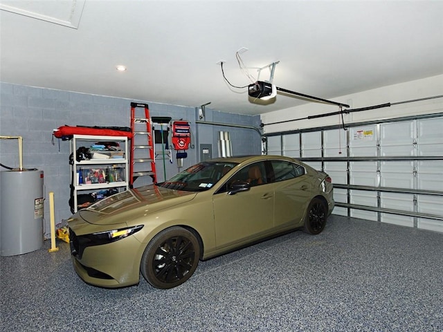 garage with water heater and a garage door opener