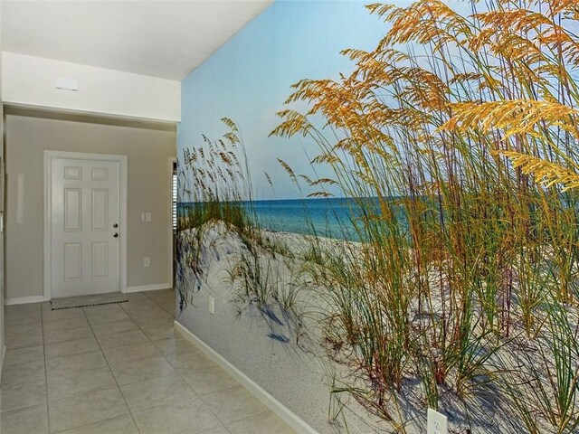 hallway featuring light tile patterned floors