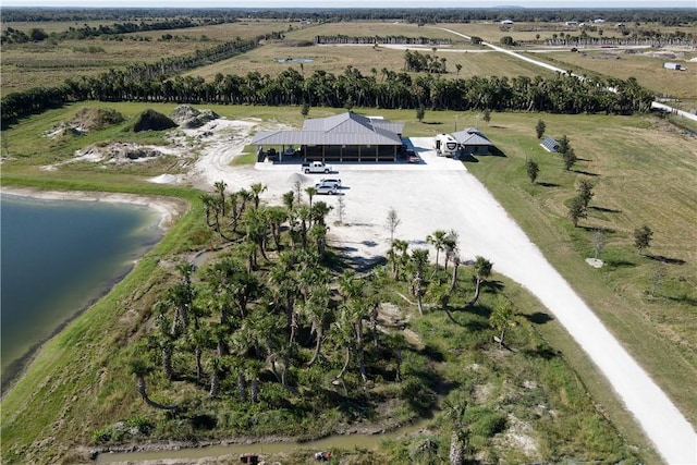 birds eye view of property with a water view and a rural view