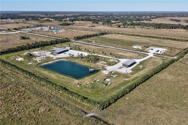 bird's eye view with a rural view and a water view