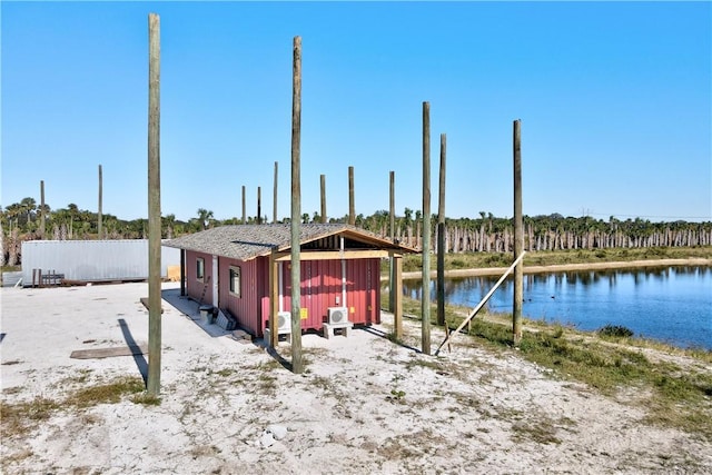 exterior space with a water view