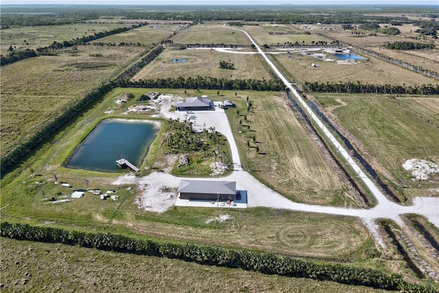 aerial view featuring a rural view and a water view