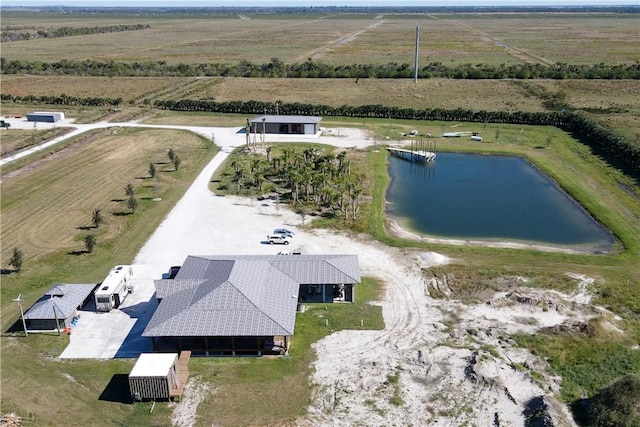 drone / aerial view with a water view and a rural view