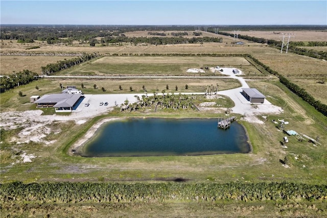 drone / aerial view featuring a rural view and a water view