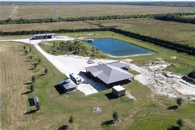 aerial view featuring a water view and a rural view