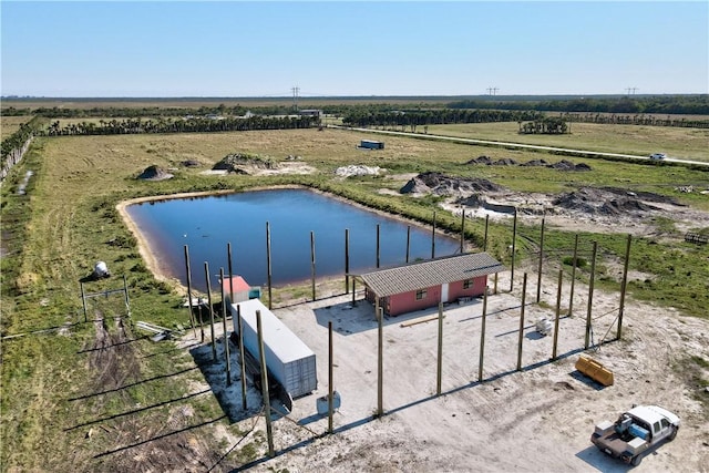 bird's eye view with a water view and a rural view