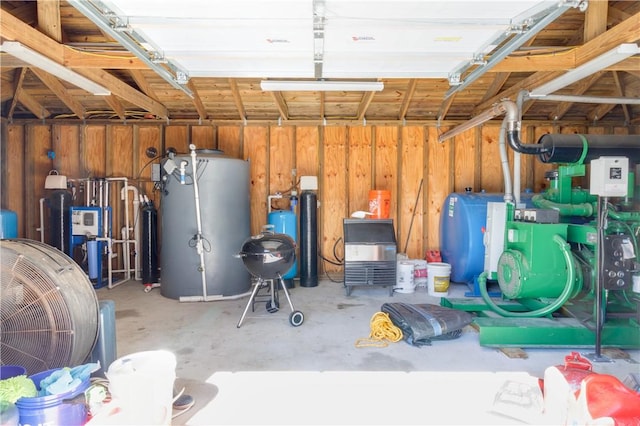 interior space with wooden walls and water heater