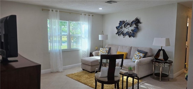 401 N 29th St, Fort Pierce, FL 34947 - living room with plenty of natural light, a textured ceiling, and recessed lighting