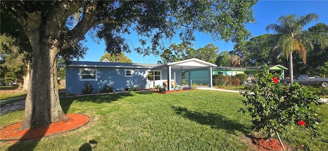 401 N 29th St, Fort Pierce, FL 34947 - ranch-style home with a front lawn, an attached carport, and stucco siding