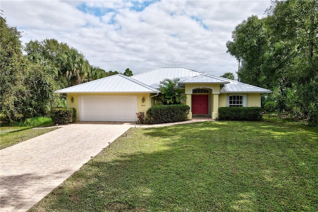 view of front facade featuring a garage and a front lawn