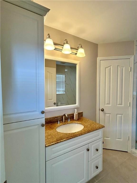 bathroom with vanity and tile patterned floors