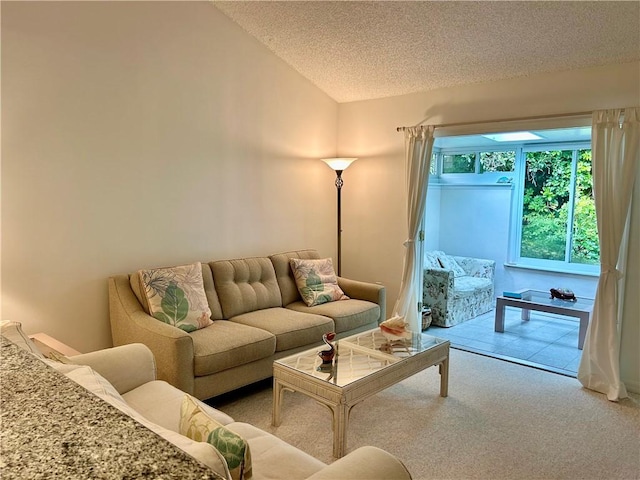 carpeted living room featuring a textured ceiling and vaulted ceiling