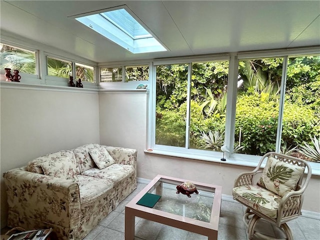 sunroom featuring vaulted ceiling with skylight