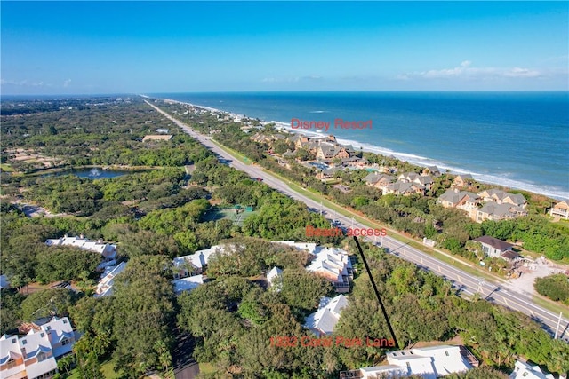 bird's eye view featuring a water view and a view of the beach