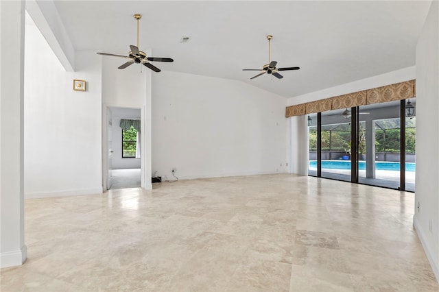 empty room with lofted ceiling, a healthy amount of sunlight, and ceiling fan